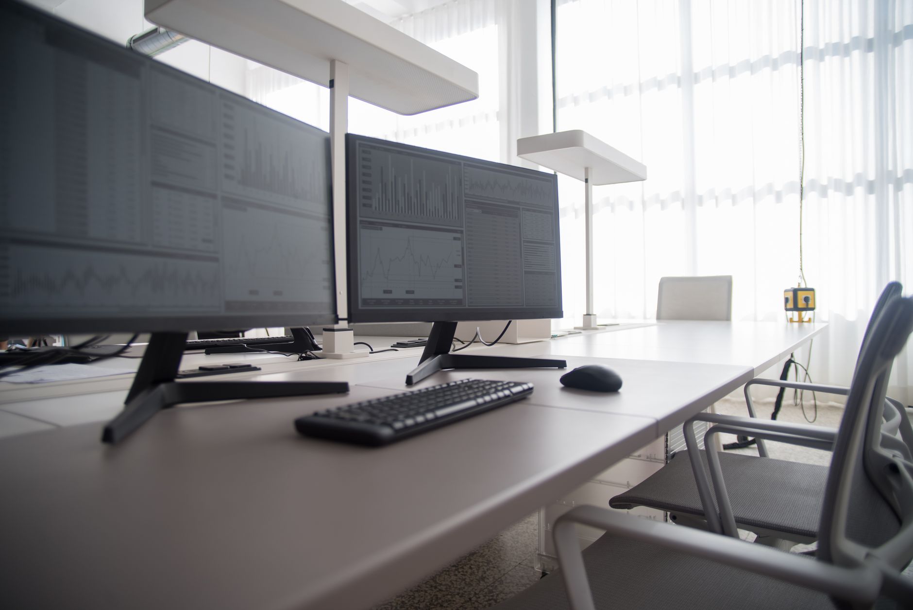 Modern tech park in Kenya with computer terminals showing code